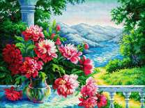 Букетик пионов на фоне горной реки